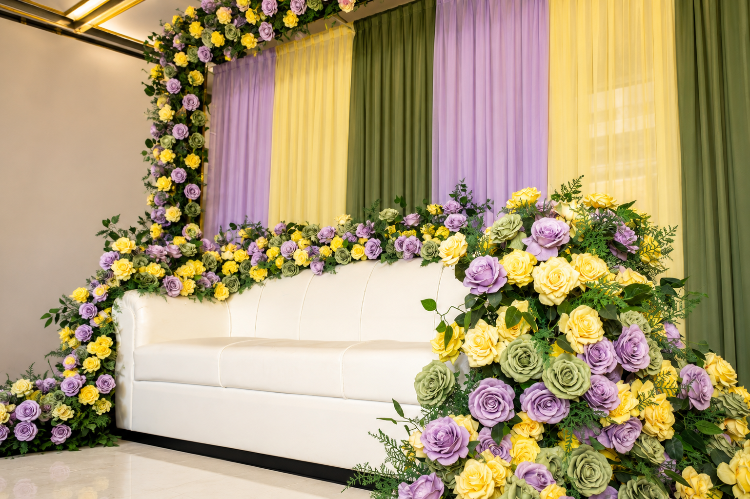Lavender and yellow floral lounge stage with white sofa, side angle